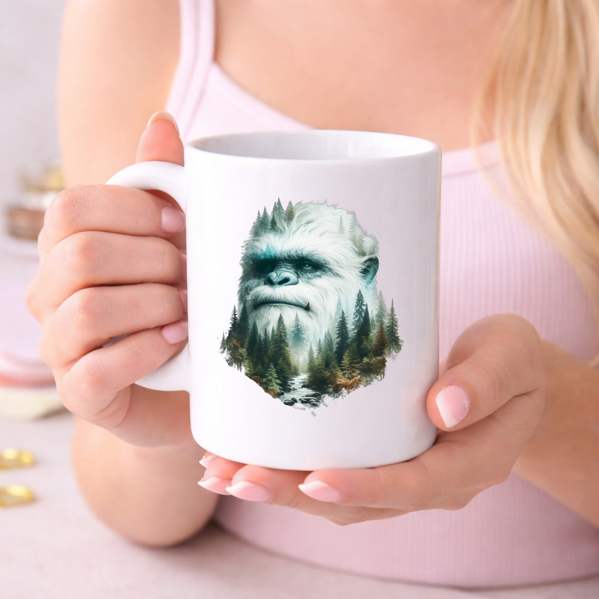 Bigfoot Face UV DTF sticker applied to a white coffee mug held in both hands