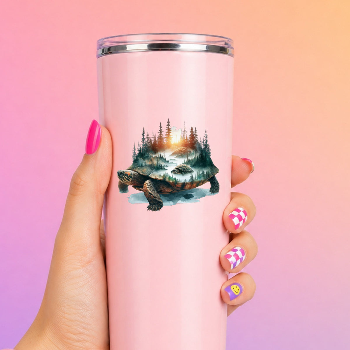 Sunset Turtle UV DTF sticker applied to a tall pink tumbler on a pink and orange background