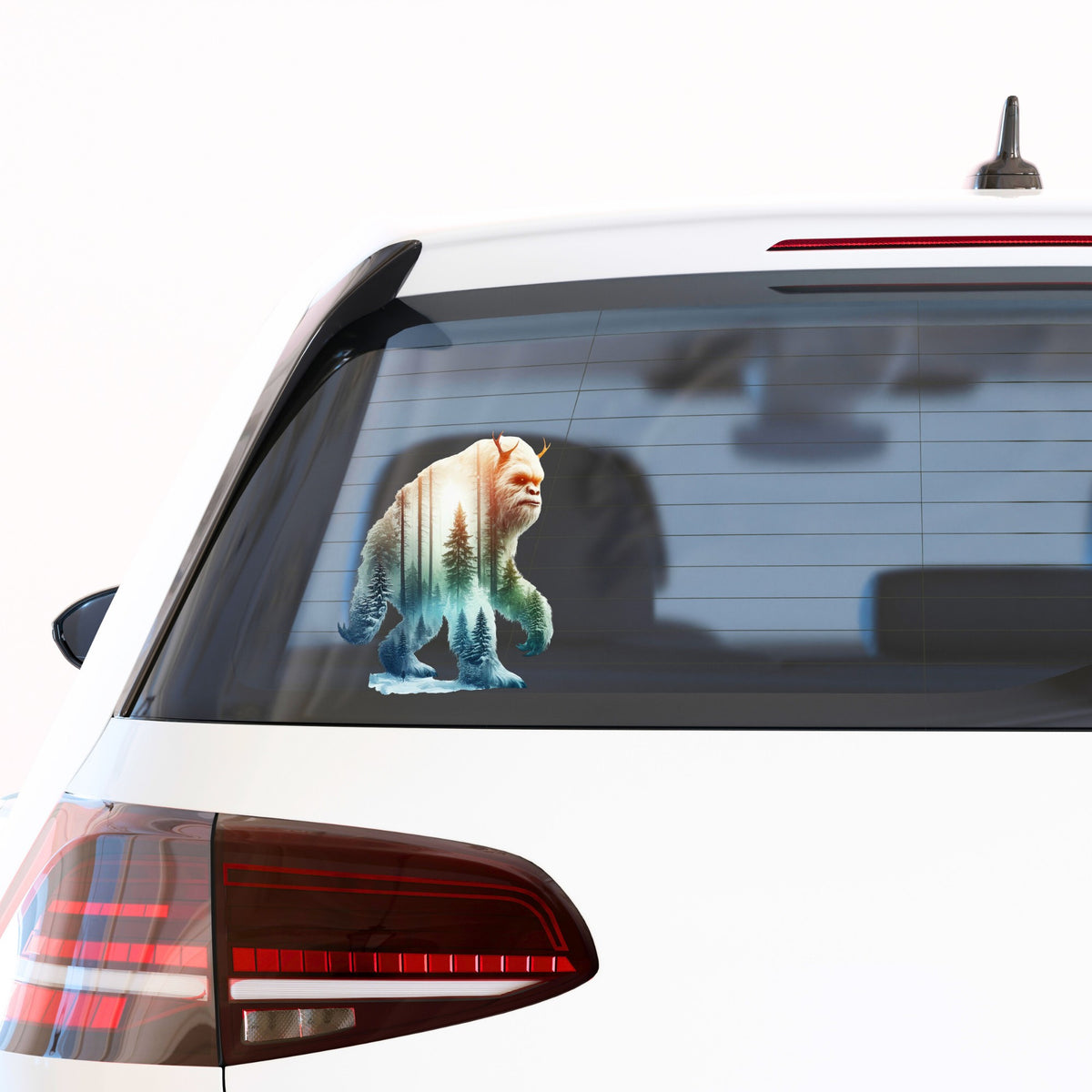 Walking Sasquatch UV DTF sticker applied to the rear window of a white car