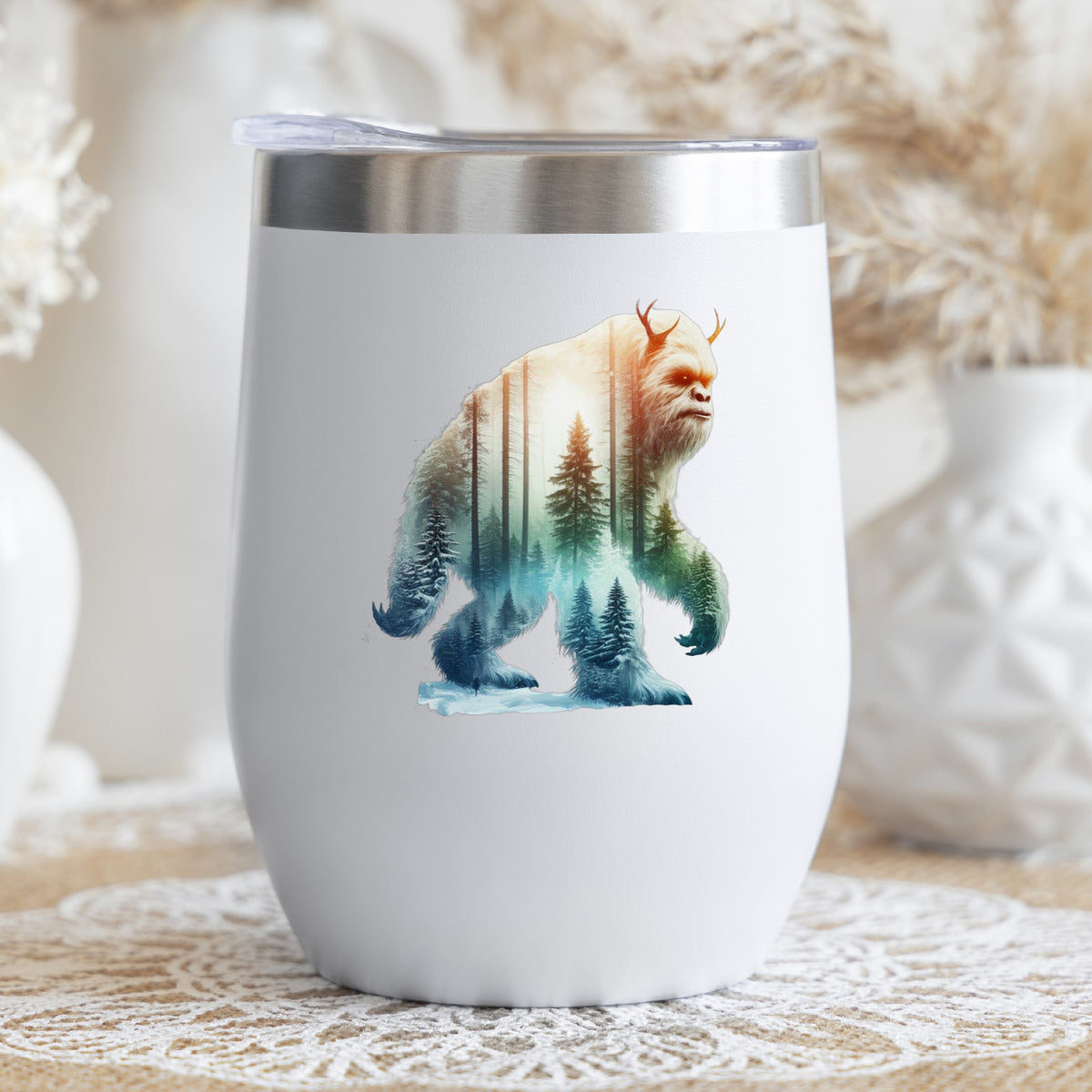 Walking Sasquatch UV DTF sticker applied to a white stemless tumbler with a lid