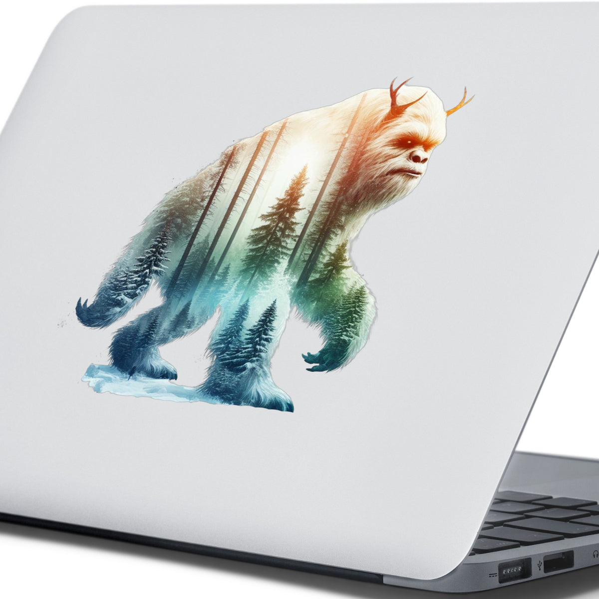 Walking Sasquatch UV DTF sticker applied to the lid of a silver laptop