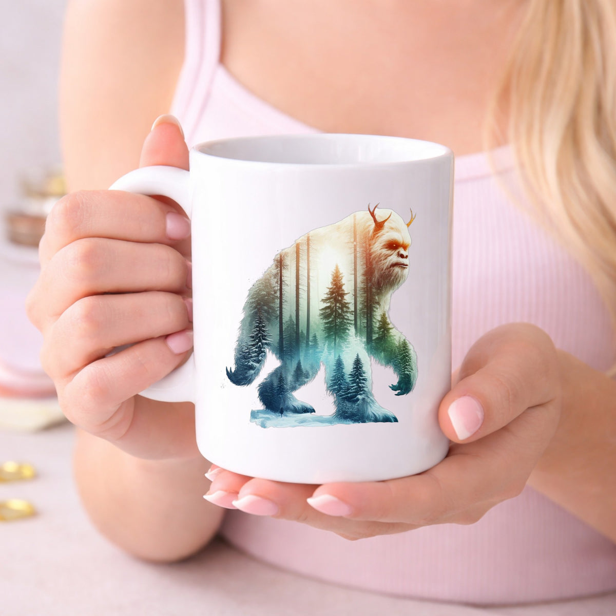 Walking Sasquatch UV DTF sticker applied to a white coffee mug held in both hands