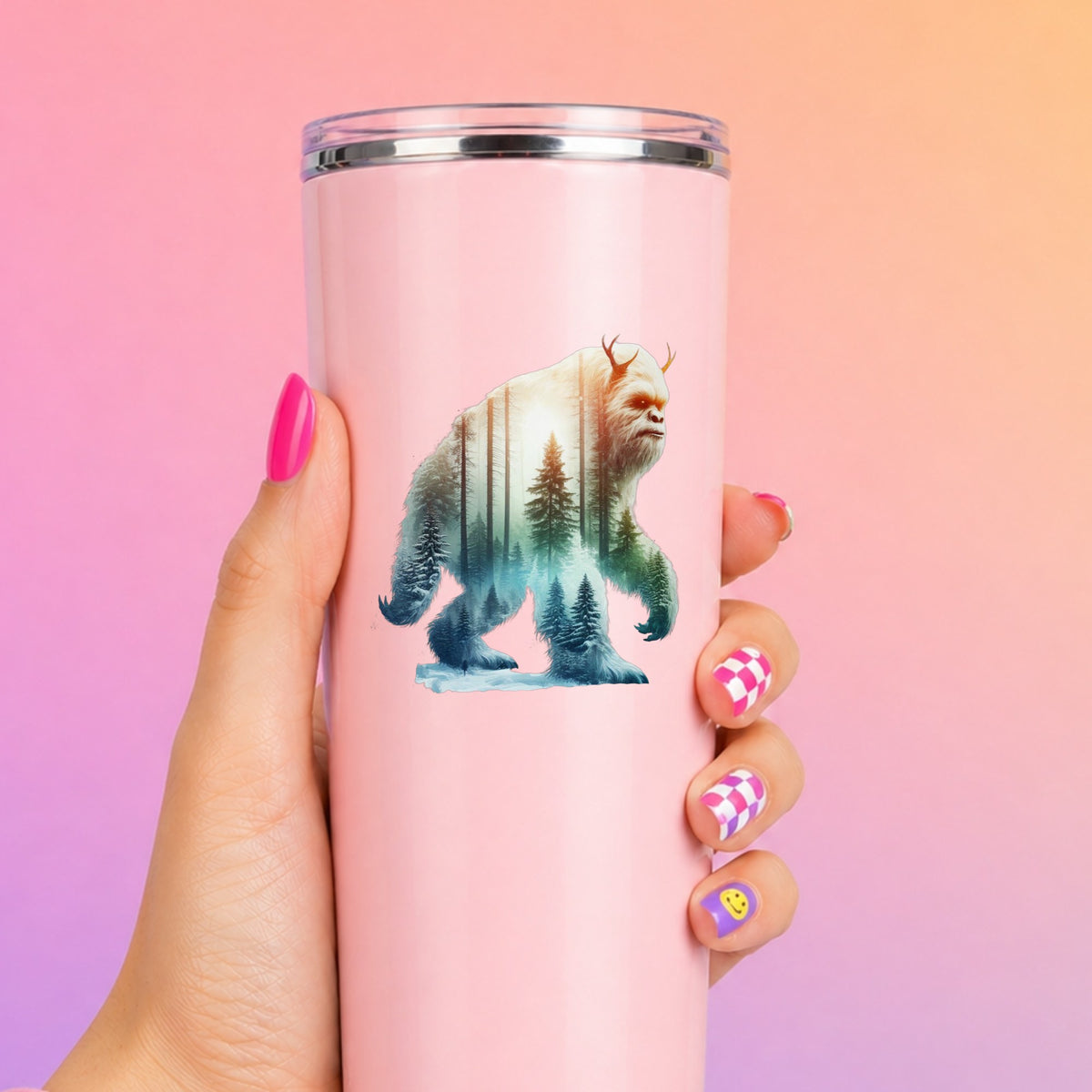 Walking Sasquatch UV DTF sticker applied to a tall pink tumbler on a pink and orange background