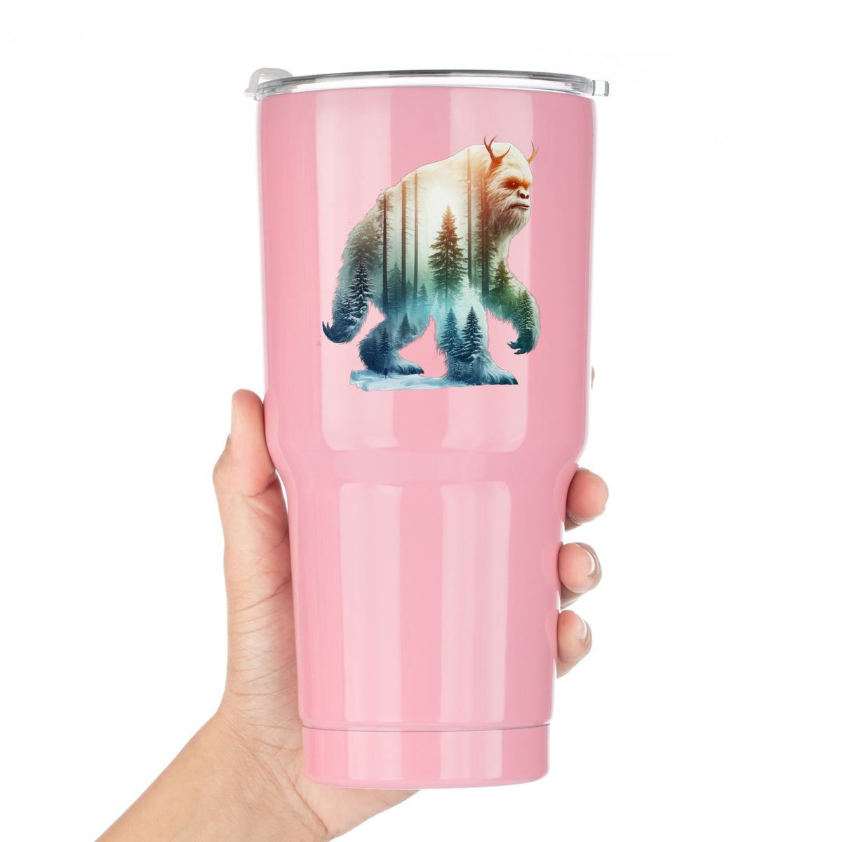 Walking Sasquatch UV DTF sticker applied to a pink tumbler held against a white background