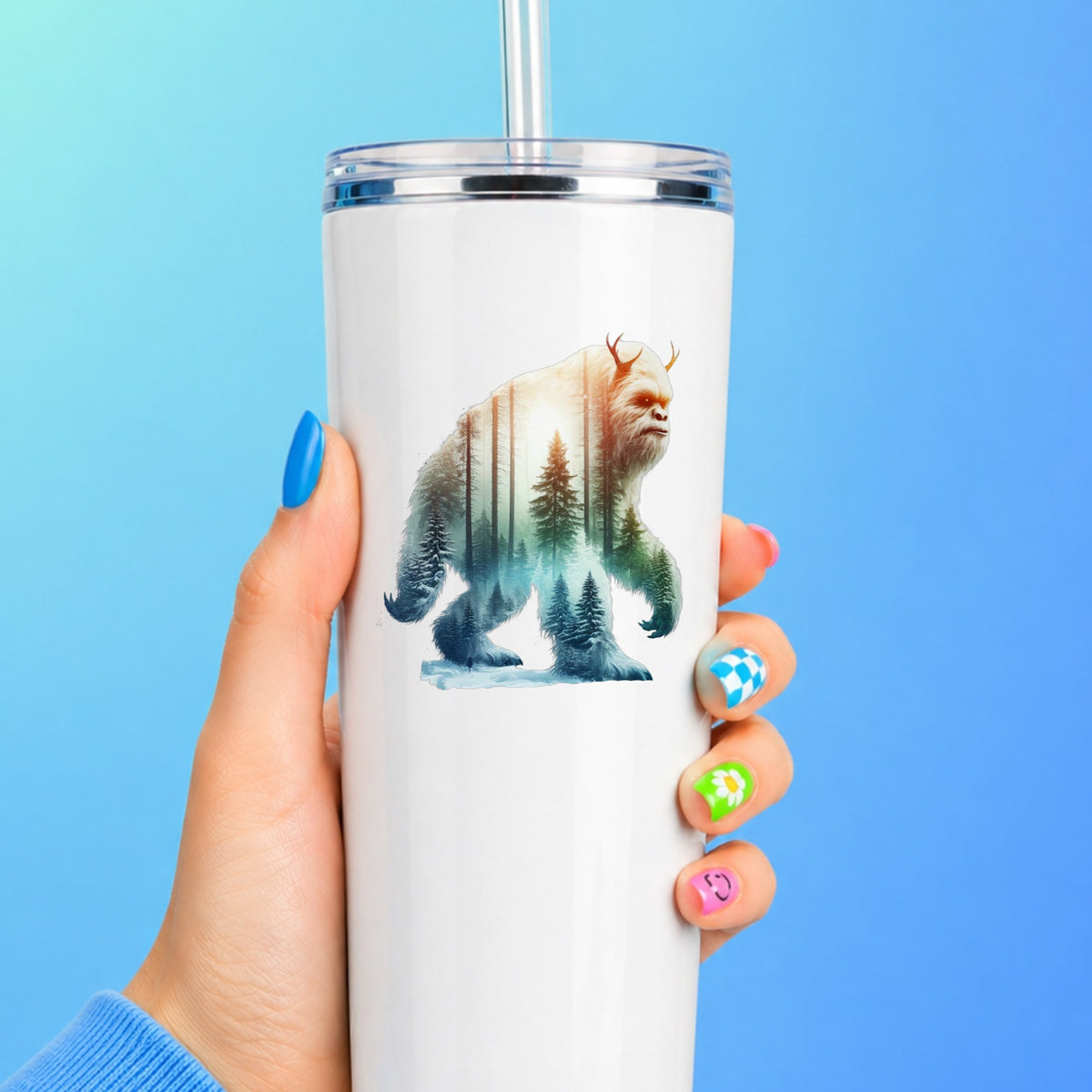 Walking Sasquatch UV DTF sticker applied to a white straw tumbler on a blue background