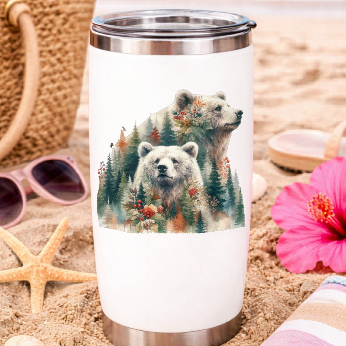 Two Bears UV DTF sticker applied to a white travel tumbler on beach sand