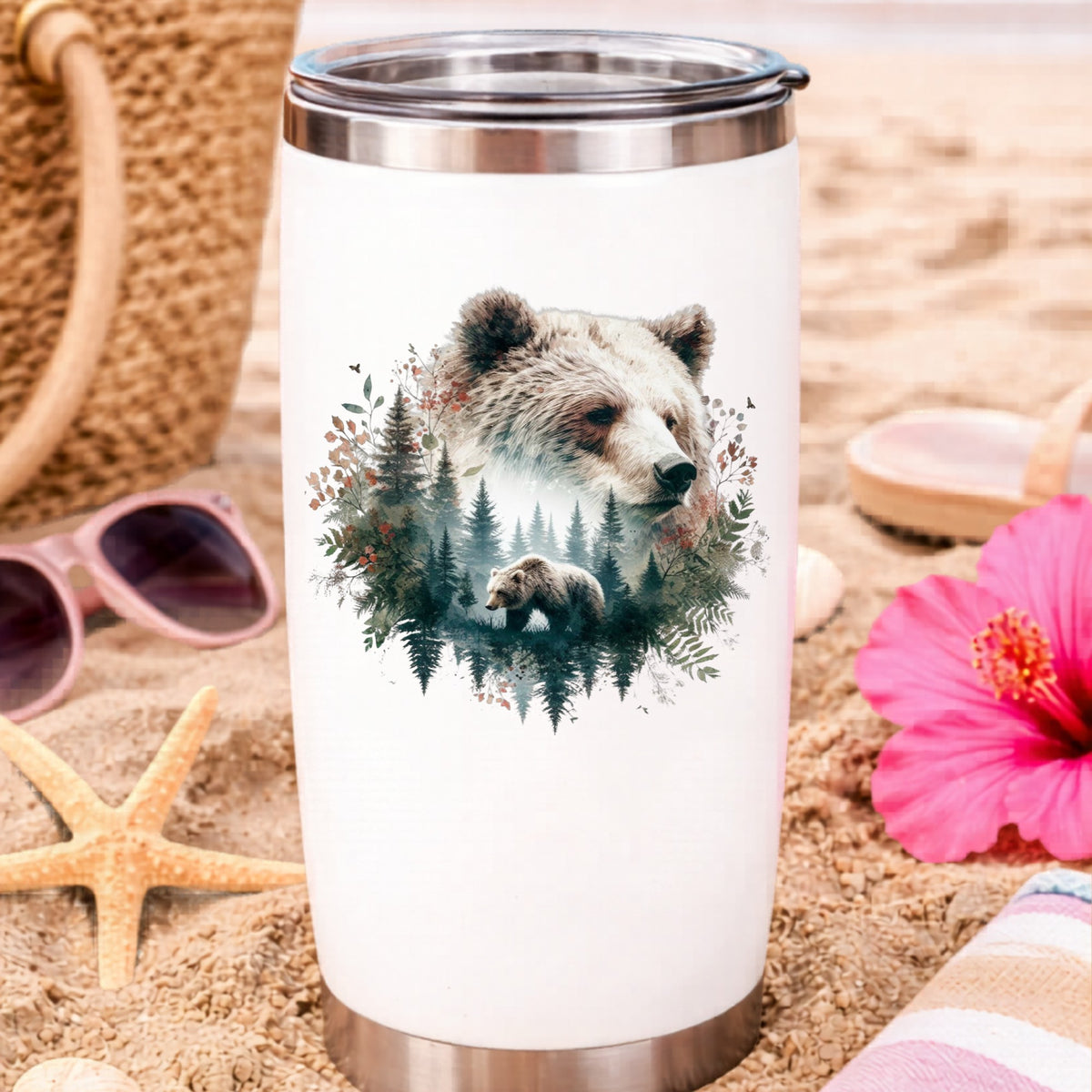 Brown Bear Botanical UV DTF sticker applied to a white travel tumbler on beach sand