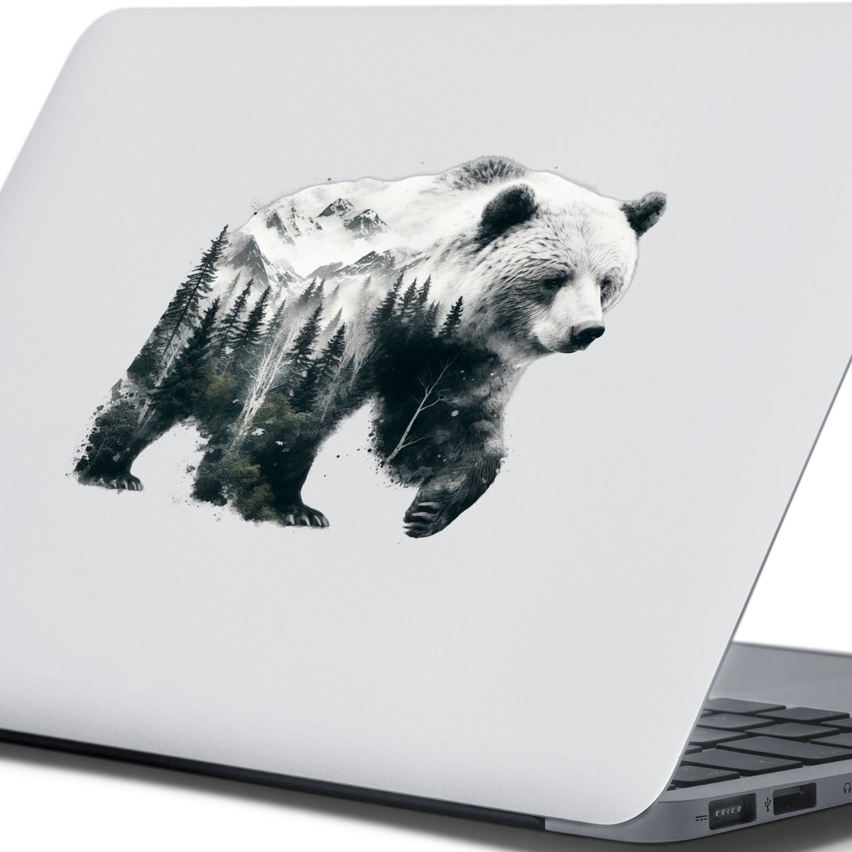 Mountain Bear UV DTF sticker applied to the lid of a silver laptop