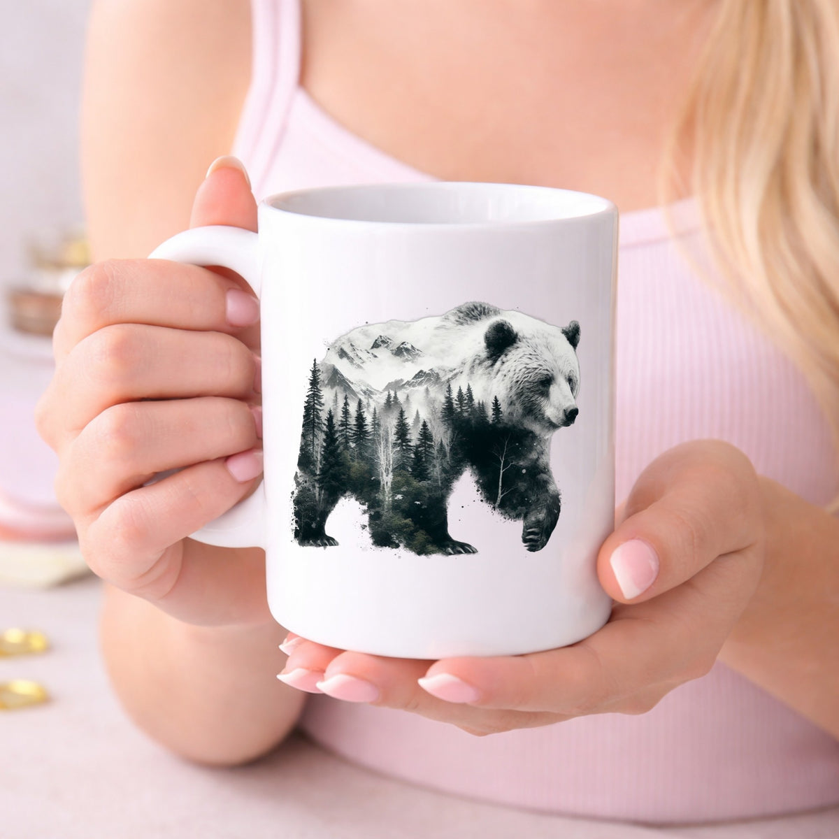 Mountain Bear UV DTF sticker applied to a white coffee mug held in both hands