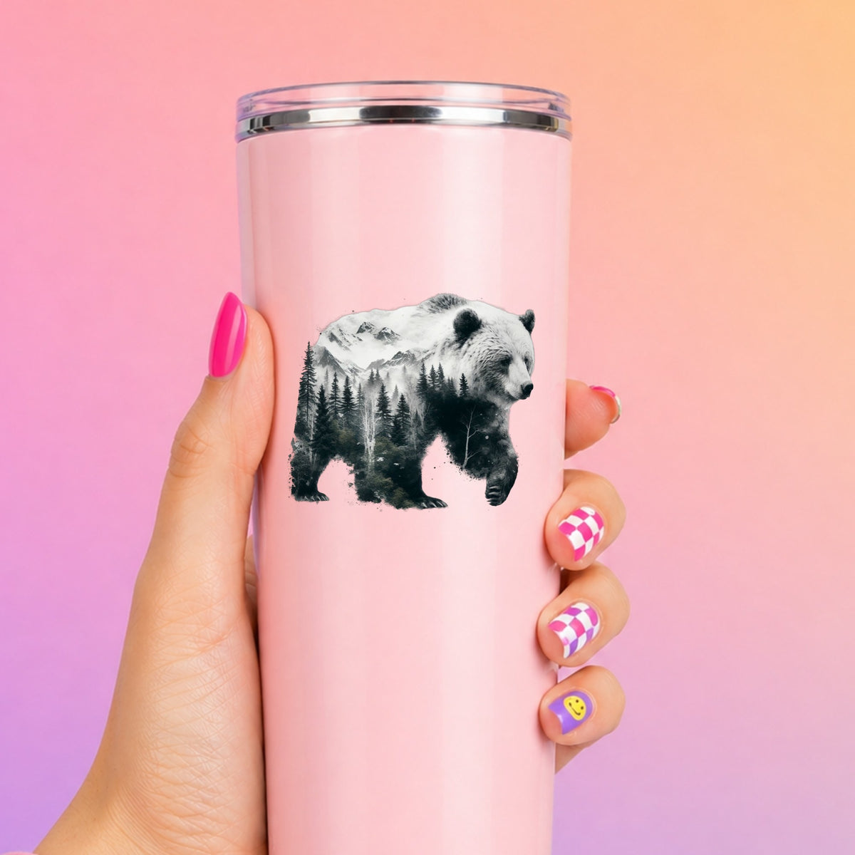 Mountain Bear UV DTF sticker applied to a tall pink tumbler on a pink and orange background