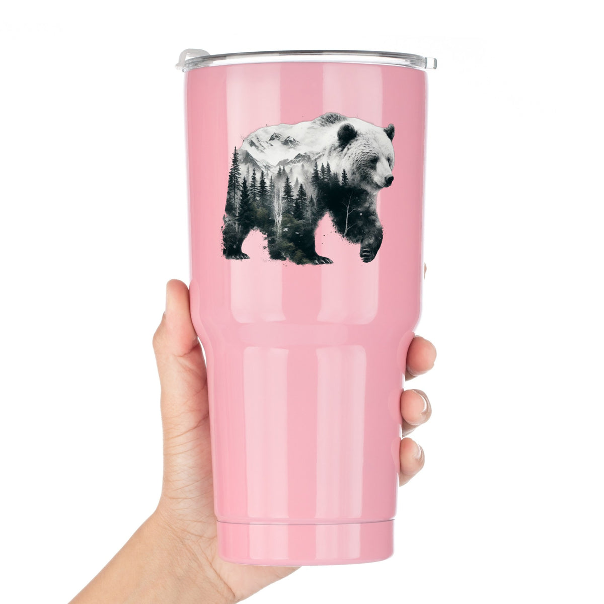 Mountain Bear UV DTF sticker applied to a pink tumbler held against a white background