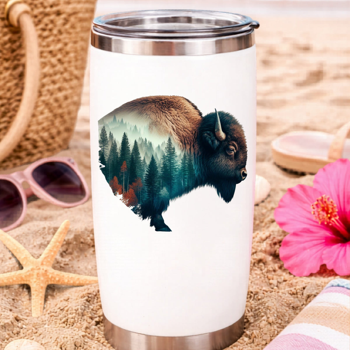 Bison Profile UV DTF sticker applied to a white travel tumbler on beach sand