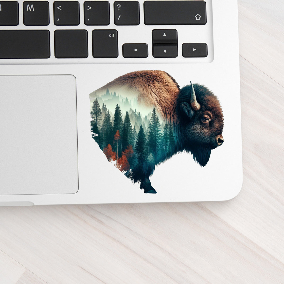 Bison Profile UV DTF sticker applied to a silver laptop beside the keyboard