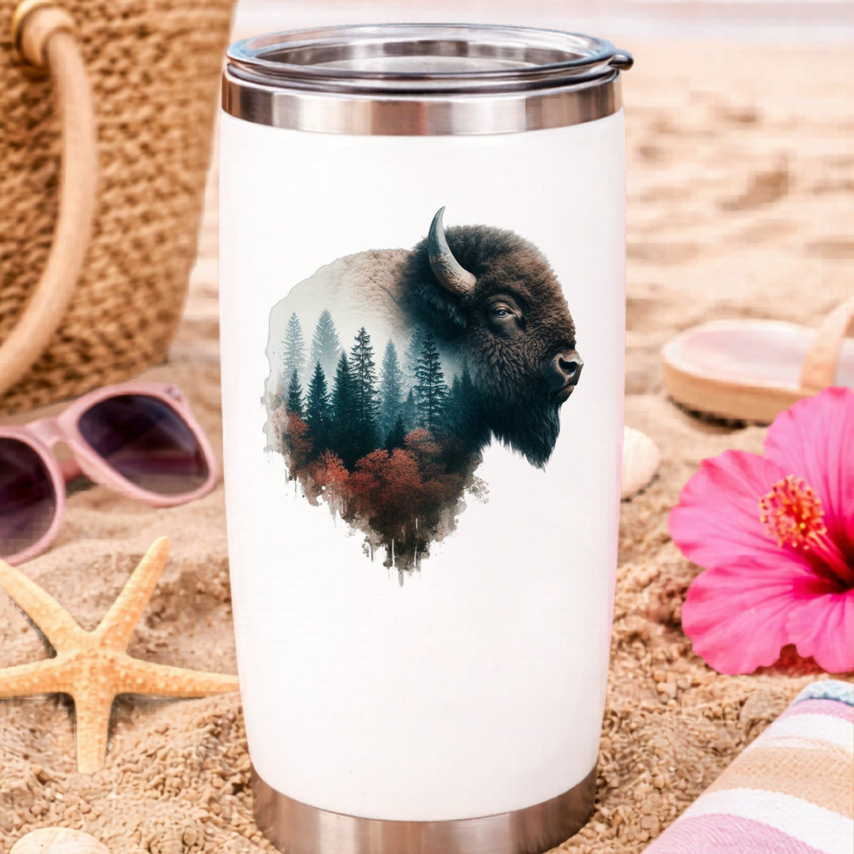 Buffalo Head UV DTF sticker applied to a white travel tumbler on beach sand