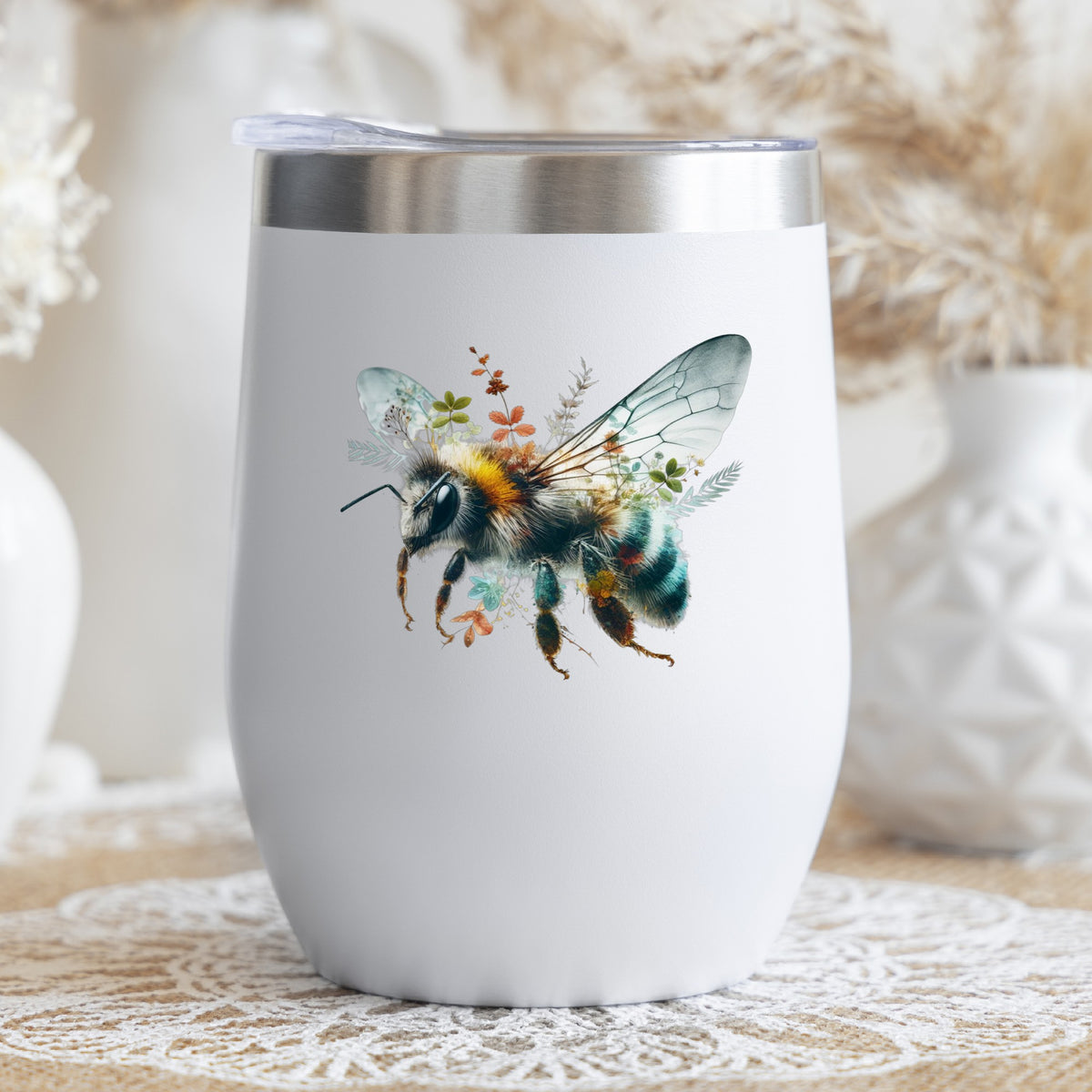 Botanical Bumblebee UV DTF sticker applied to a white stemless tumbler with a lid