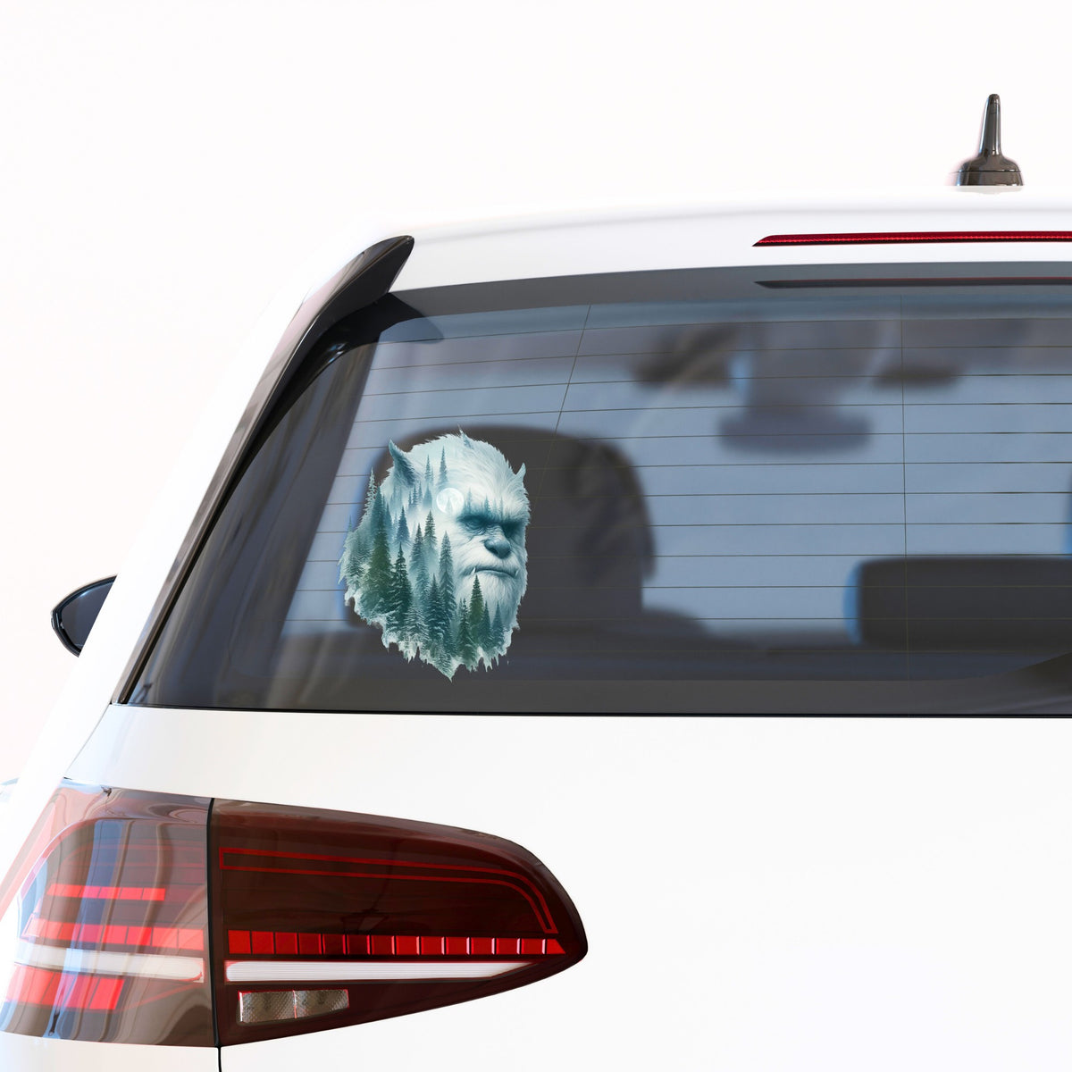 Full Moon Sasquatch UV DTF sticker applied to the rear window of a white car