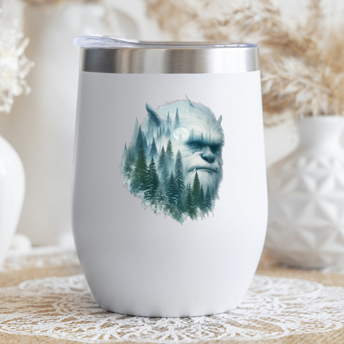 Full Moon Sasquatch UV DTF sticker applied to a white stemless tumbler with a lid