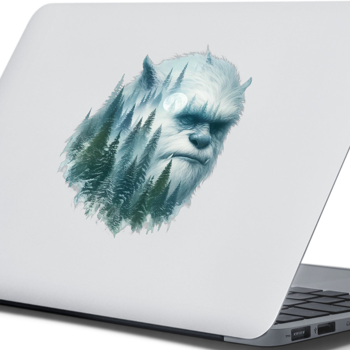 Full Moon Sasquatch UV DTF sticker applied to the lid of a silver laptop