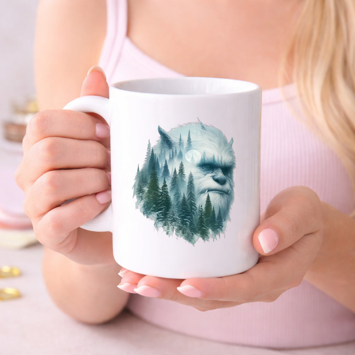 Full Moon Sasquatch UV DTF sticker applied to a white coffee mug held in both hands