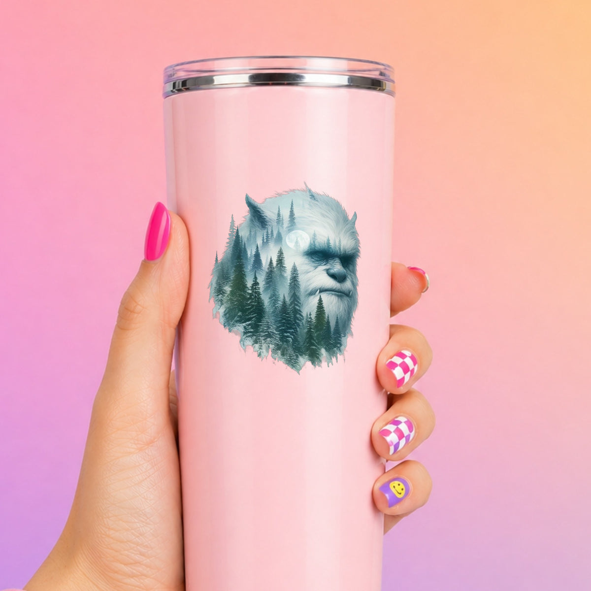 Full Moon Sasquatch UV DTF sticker applied to a tall pink tumbler on a pink and orange background
