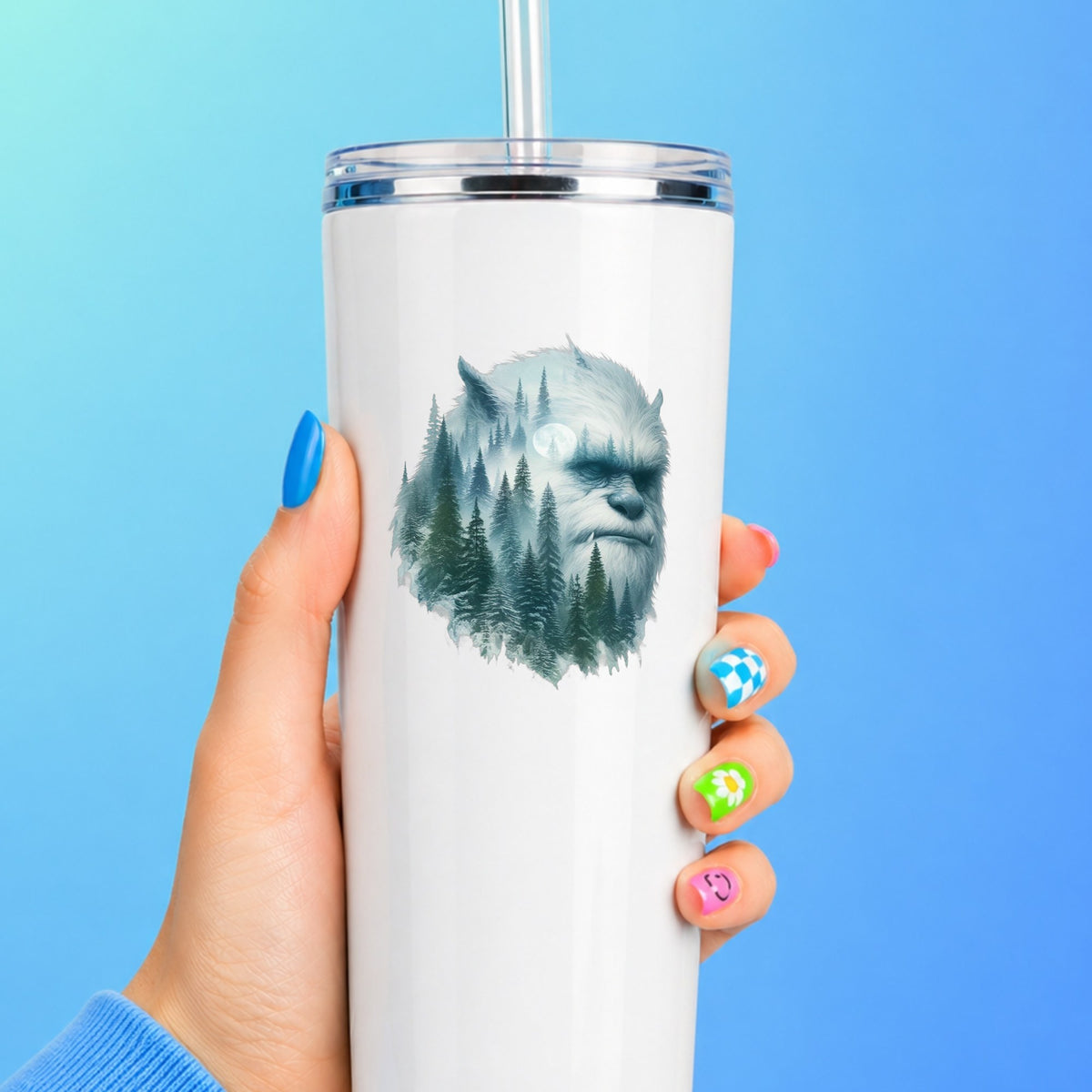 Full Moon Sasquatch UV DTF sticker applied to a white straw tumbler on a blue background