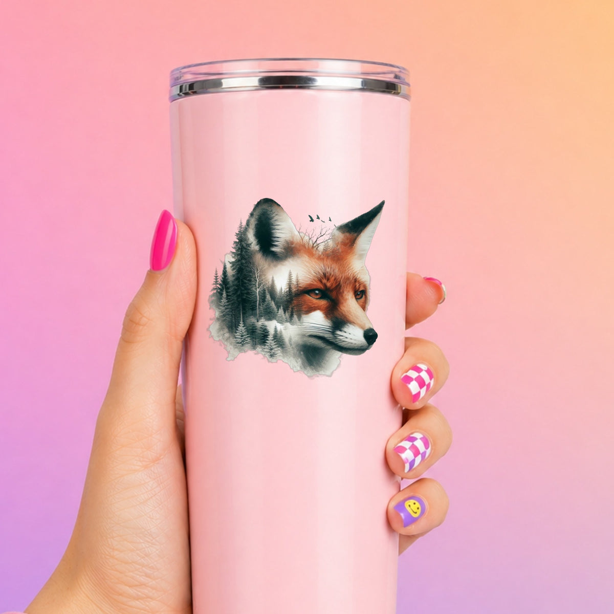 Pine Forest Fox UV DTF sticker applied to a tall pink tumbler on a pink and orange background