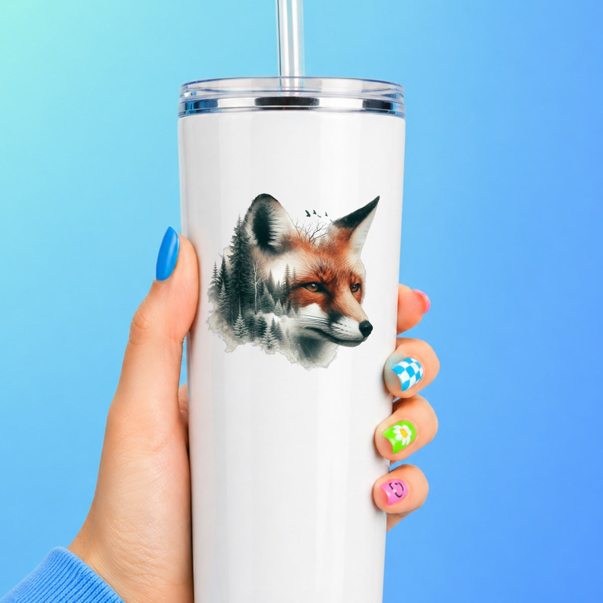 Pine Forest Fox UV DTF sticker applied to a white straw tumbler on a blue background