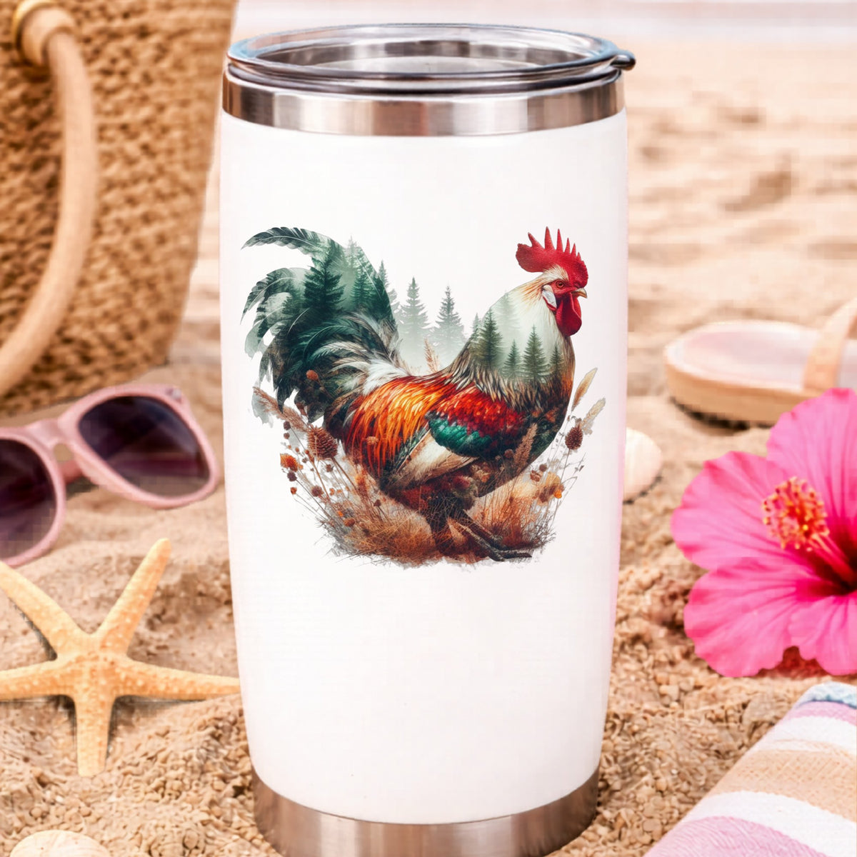 Colorful Rooster UV DTF sticker applied to a white travel tumbler on beach sand
