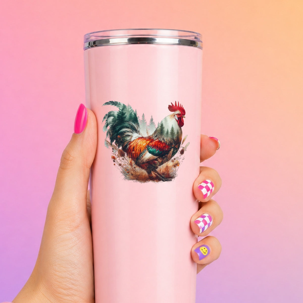 Colorful Rooster UV DTF sticker applied to a tall pink tumbler on a pink and orange background