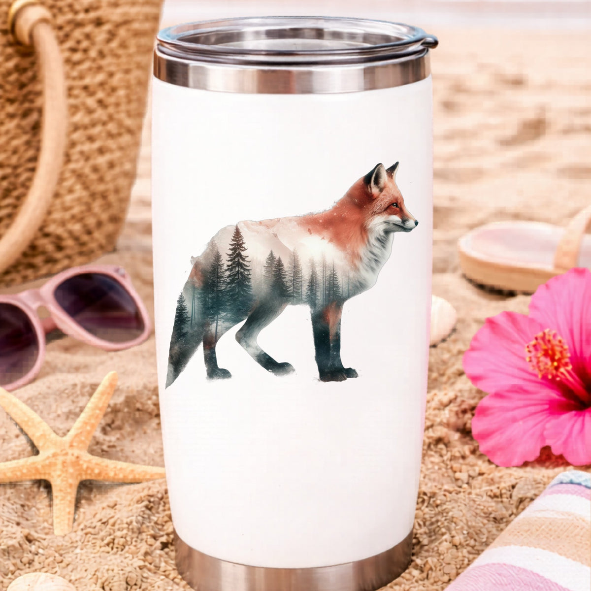 Standing Red Fox UV DTF sticker applied to a white travel tumbler on beach sand