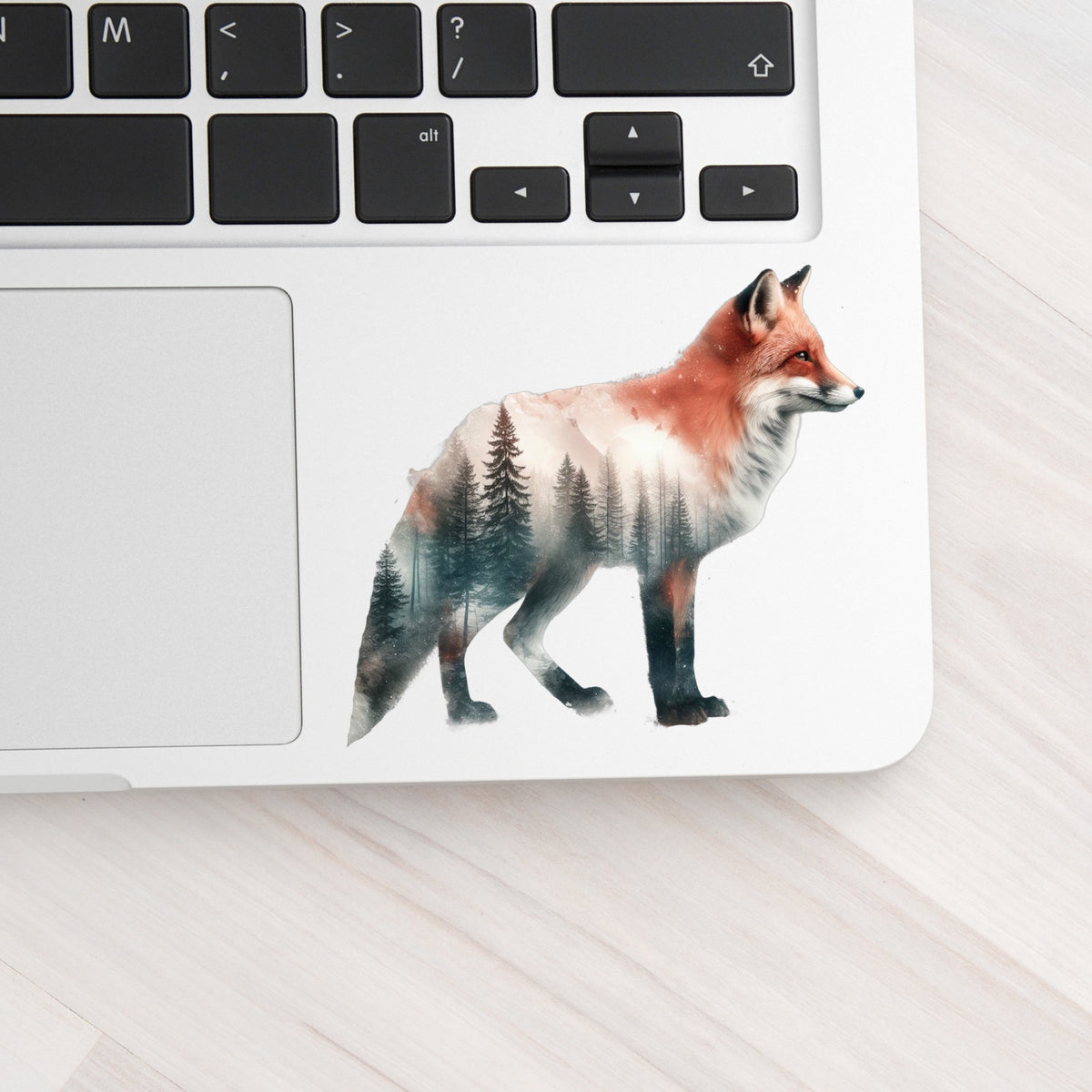Standing Red Fox UV DTF sticker applied to a silver laptop beside the keyboard