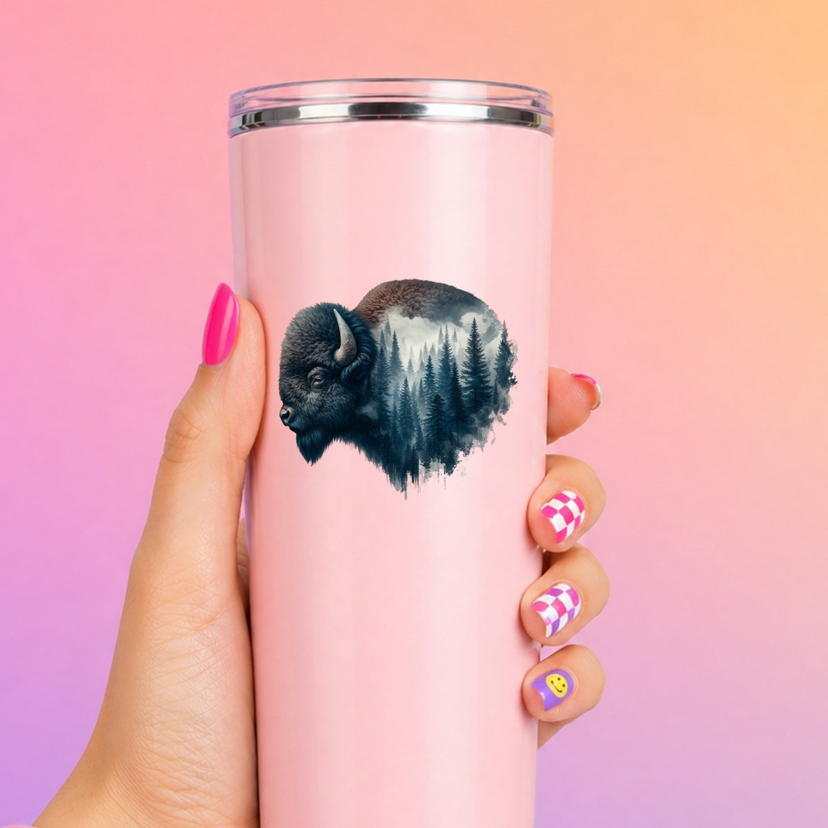 Dark Blue Bison UV DTF sticker applied to a tall pink tumbler on a pink and orange background
