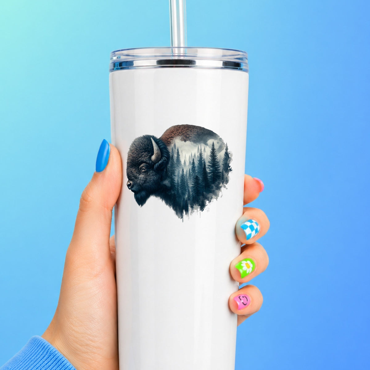 Dark Blue Bison UV DTF sticker applied to a white straw tumbler on a blue background