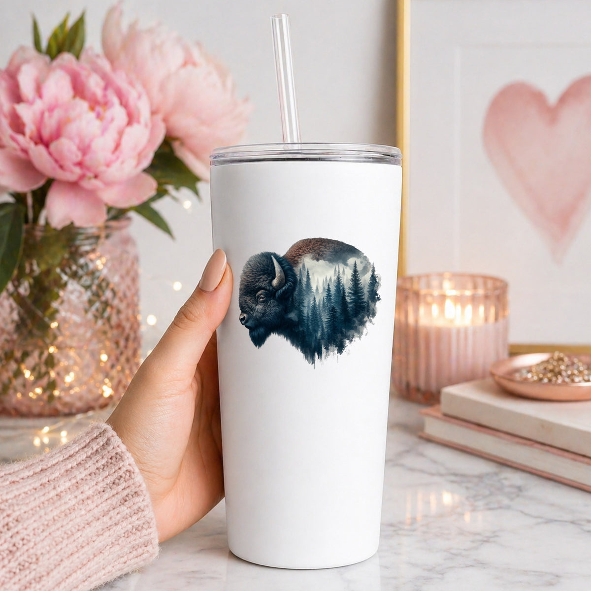 Dark Blue Bison UV DTF sticker applied to a white straw tumbler beside pink peonies