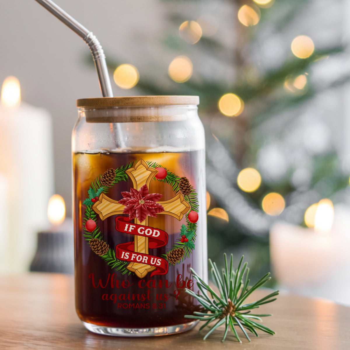If God Is For Us Christmas Cross UV DTF sticker applied to a glass can cup of iced coffee with a straw