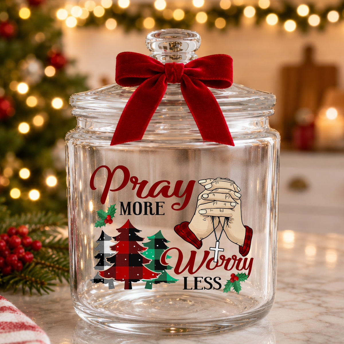 Pray More Worry Less Praying Hands UV DTF sticker applied to a glass candy jar tied with a red bow