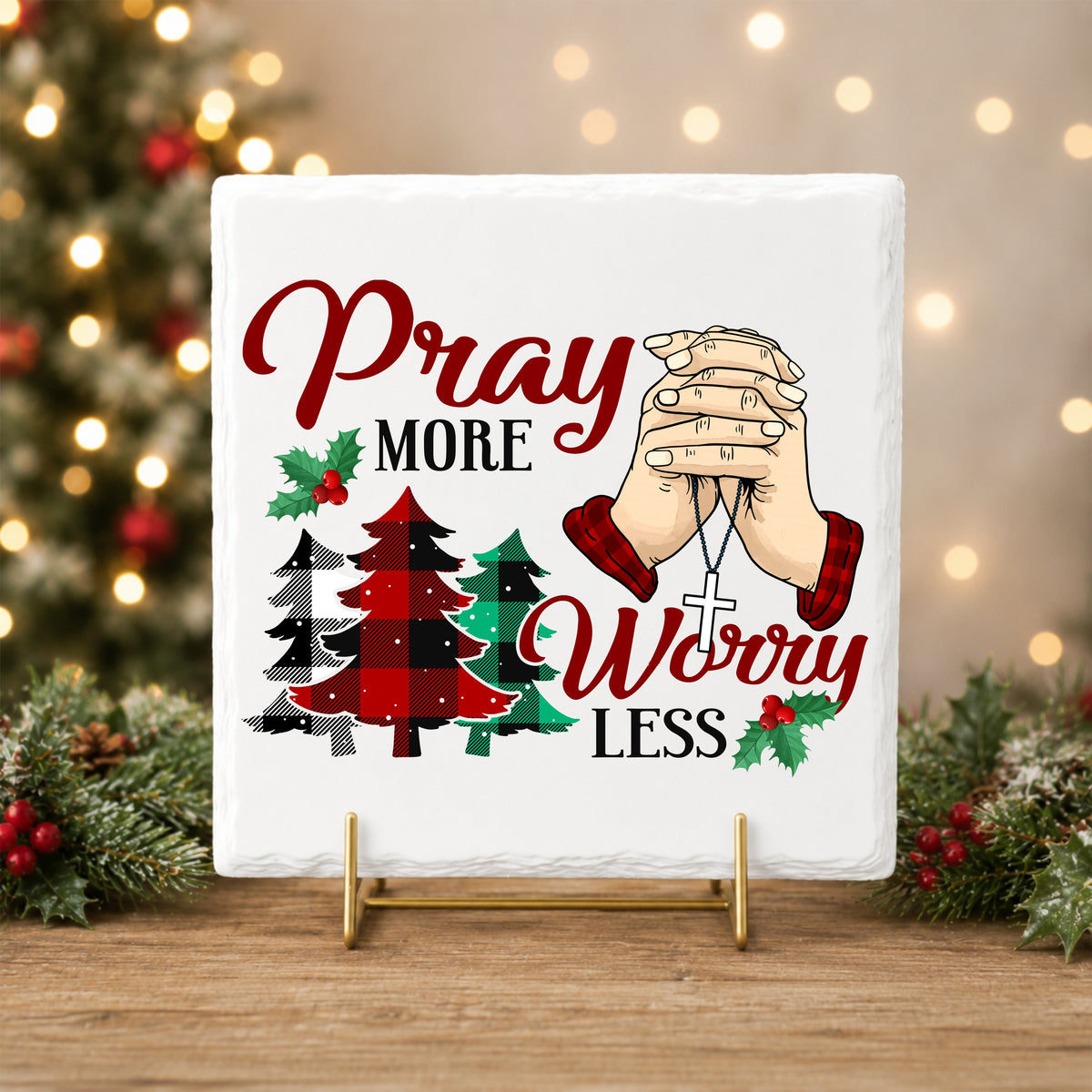Pray More Worry Less Praying Hands UV DTF sticker applied to a white tile on a gold stand