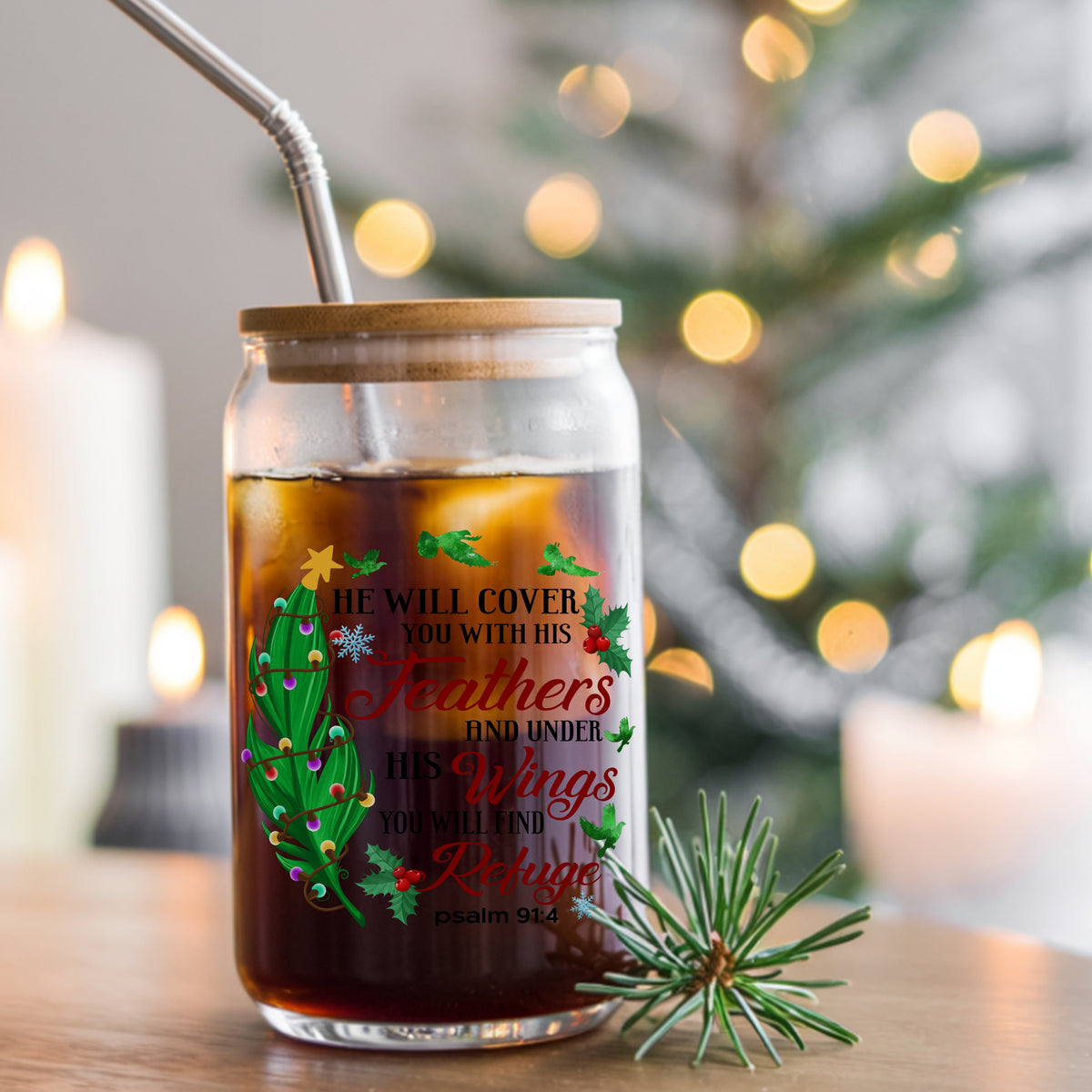 Psalm 91 Christmas Feather UV DTF sticker applied to a glass can cup of iced coffee with a straw