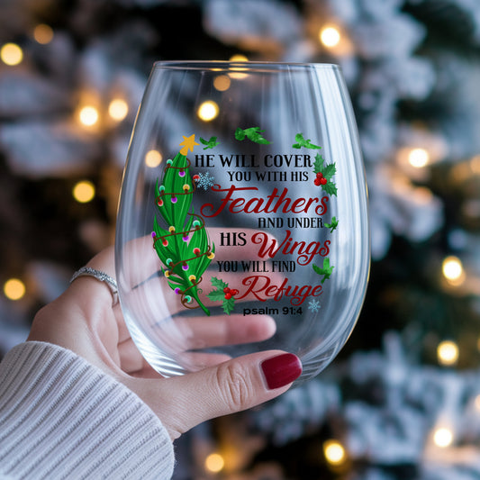 Psalm 91 Christmas Feather UV DTF sticker applied to a stemless wine glass held in hand