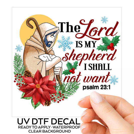 The Lord Is My Shepherd Jesus UV DTF sticker on its backing card, held in hand