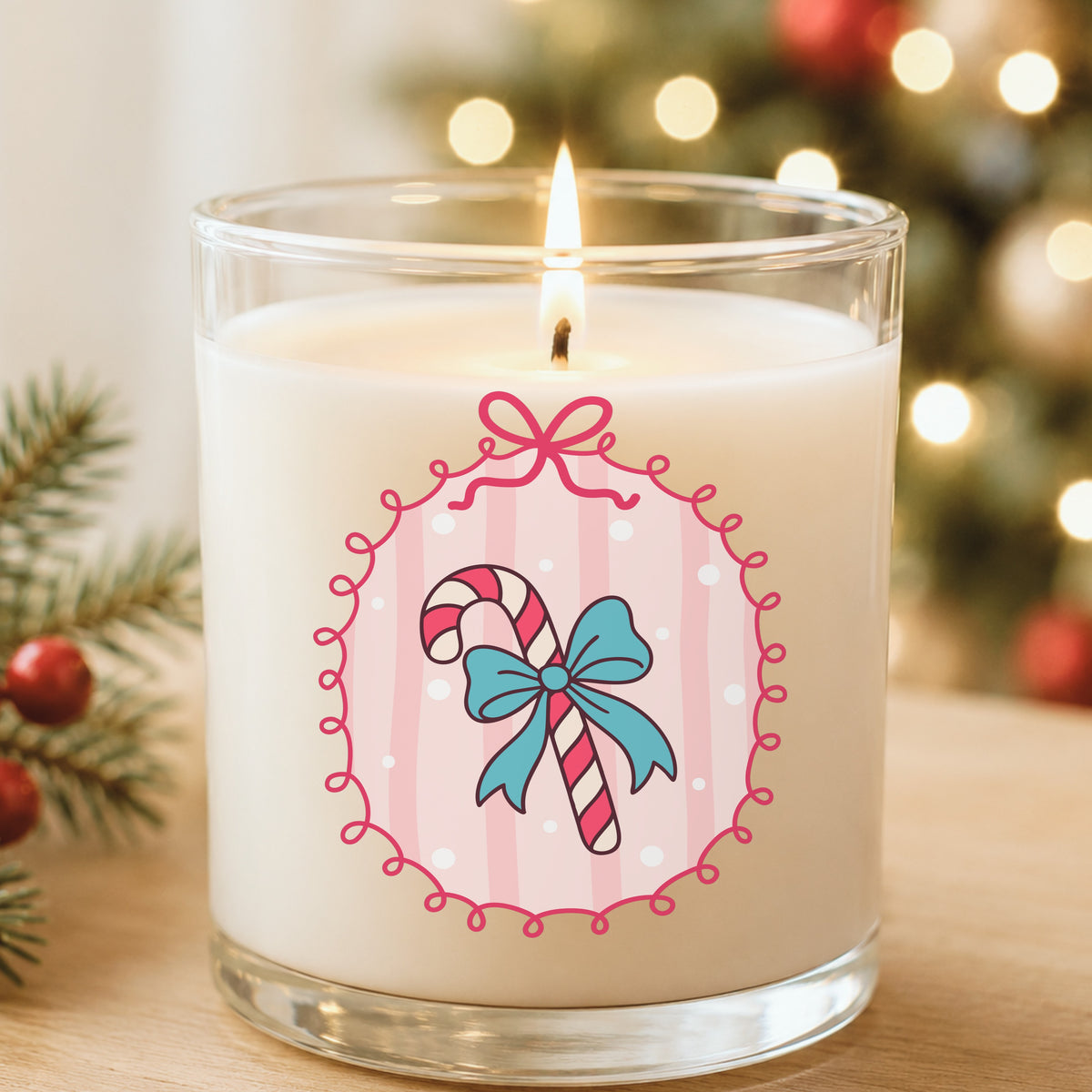 Coquette Candy Cane UV DTF sticker applied to a white candle in a glass holder near Christmas lights