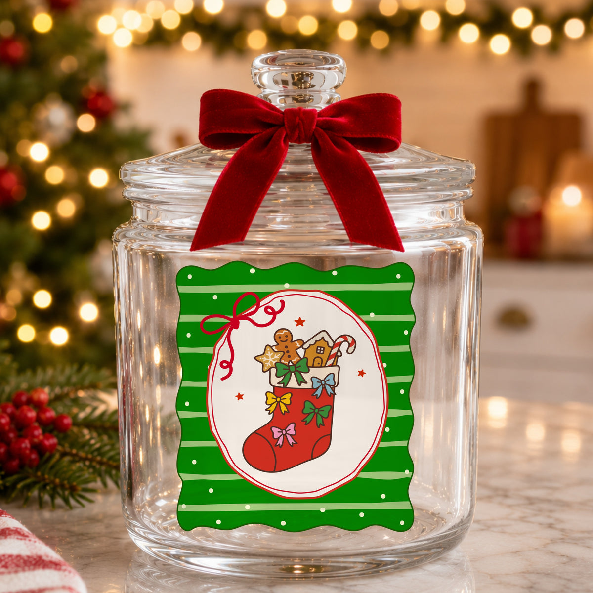 Coquette Gingerbread Stocking UV DTF sticker applied to a glass candy jar tied with a red bow
