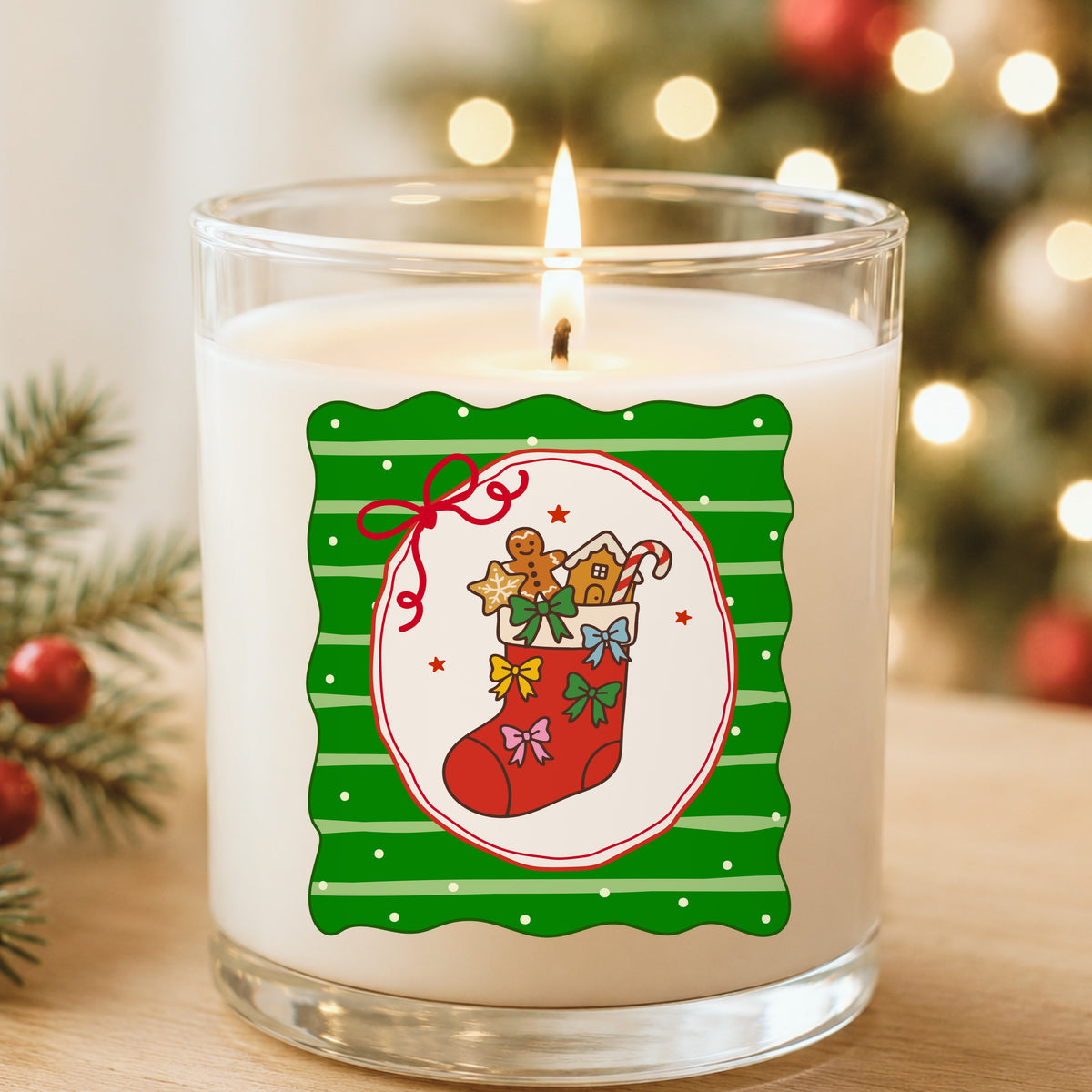 Coquette Gingerbread Stocking UV DTF sticker applied to a white candle in a glass holder near Christmas lights