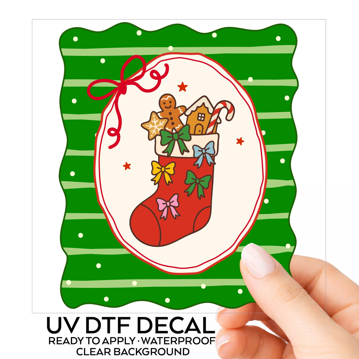 Coquette Gingerbread Stocking UV DTF sticker on its backing card, held in hand