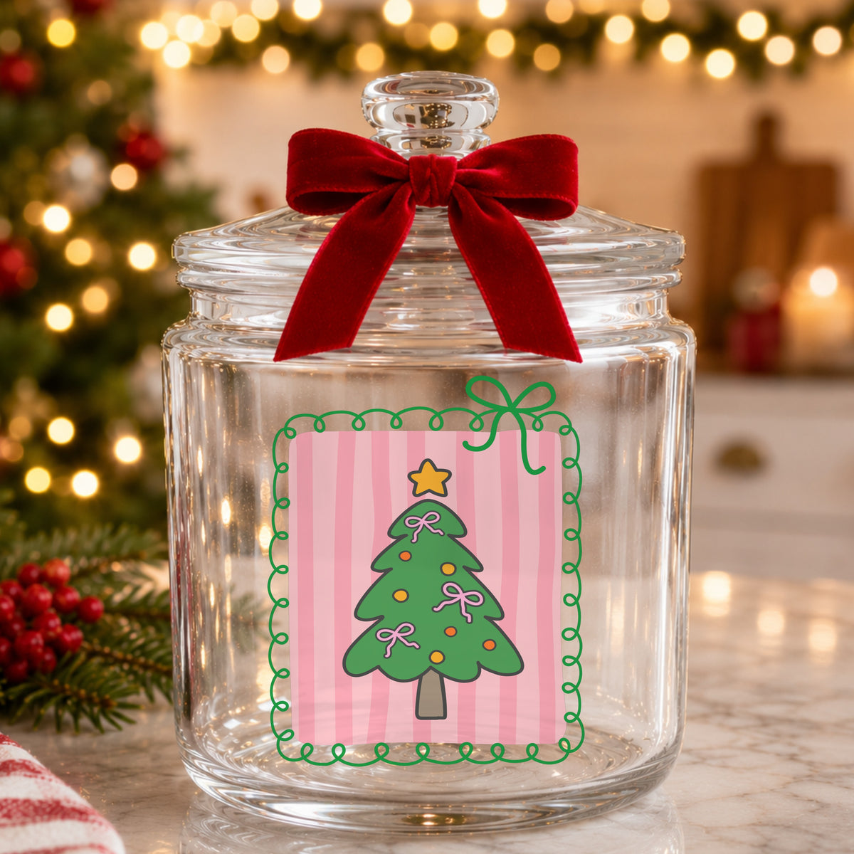 Coquette Pink Bow Christmas Tree UV DTF sticker applied to a glass candy jar tied with a red bow