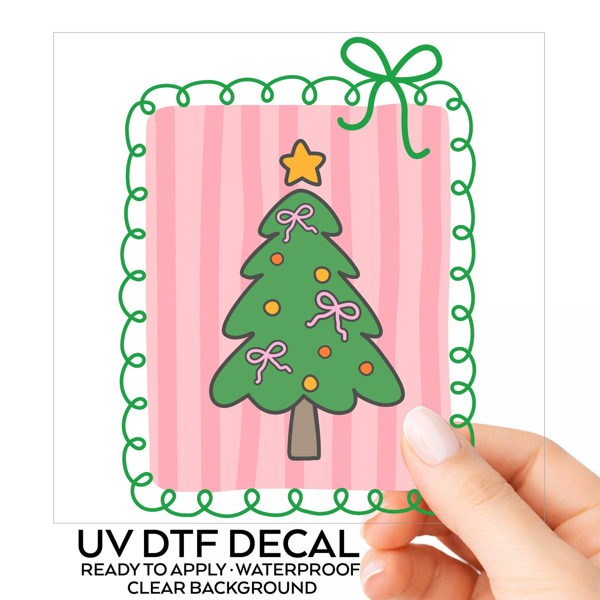 Coquette Pink Bow Christmas Tree UV DTF sticker on its backing card, held in hand