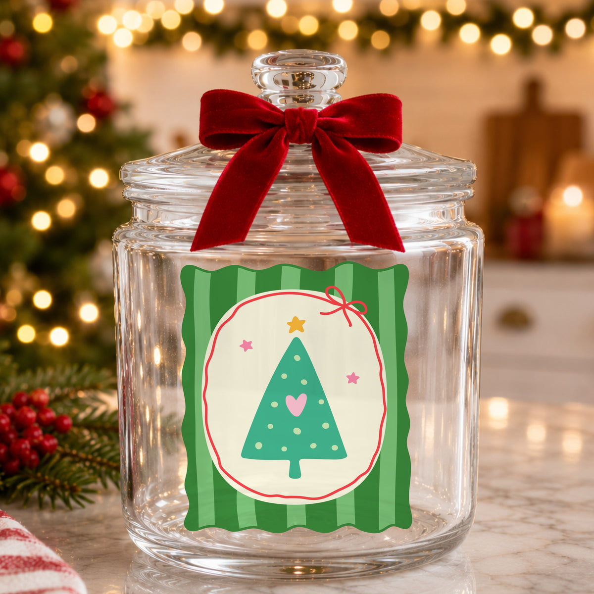 Coquette Teal Heart Christmas Tree UV DTF sticker applied to a glass candy jar tied with a red bow