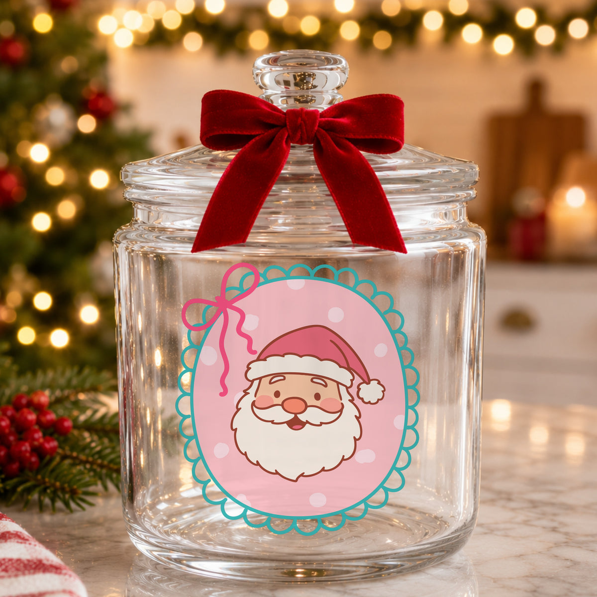 Coquette Pink Santa Claus Face UV DTF sticker applied to a glass candy jar tied with a red bow