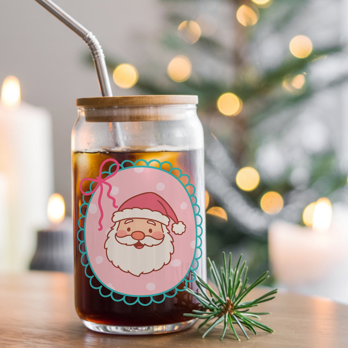 Coquette Pink Santa Claus Face UV DTF sticker applied to a glass can cup of iced coffee with a straw