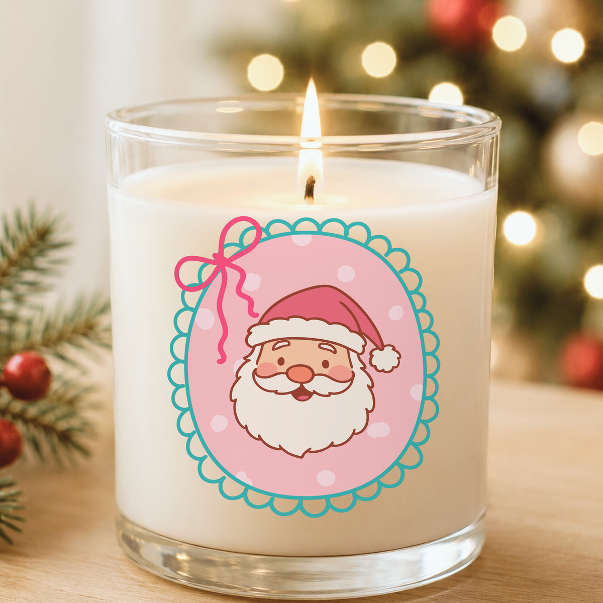 Coquette Pink Santa Claus Face UV DTF sticker applied to a white candle in a glass holder near Christmas lights